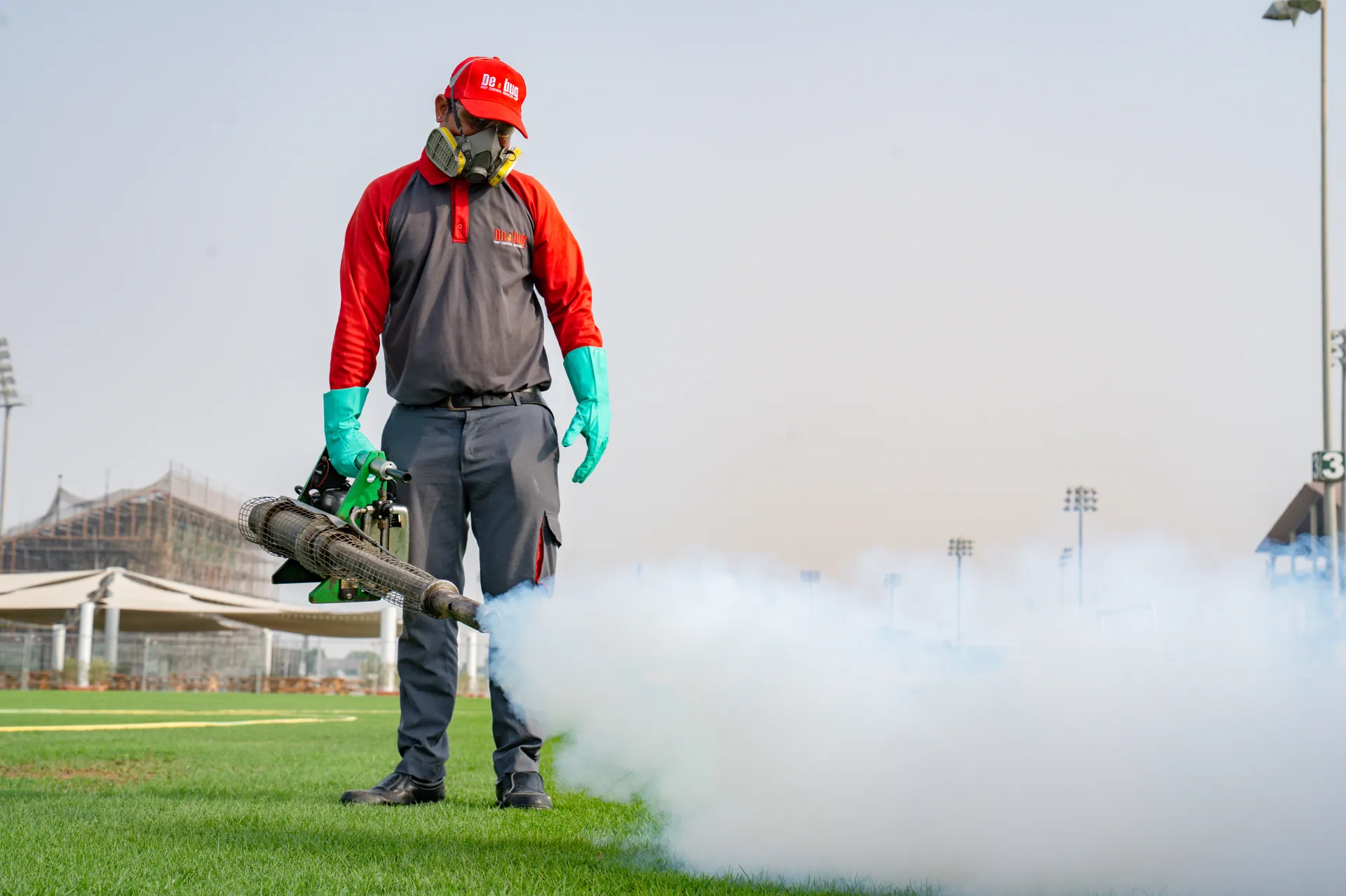 Debug technician performing industrial heat treatment for pest elimination in a commercial facility in the UAE